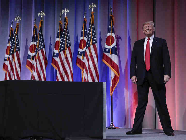 President Donald Trump smiles to supporters as he takes the podium during the Ohio Republican Party State Dinner  at the Greater Columbus Convention Center.  (Joshua A. Bickel / The Columbus Dispatch)